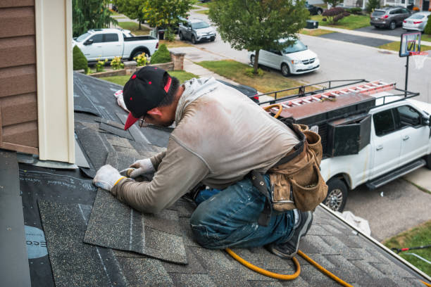 Professional Roofing technician working in Mims, FL